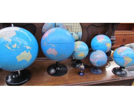 A miniature gem set globe together with six other globes