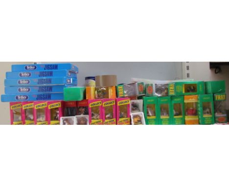 Assorted Tetley Tea related memorabilia including jigsaw puzzles, playing cards, clock, mugs, figures, key rings, coasters, c