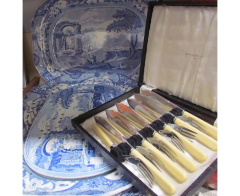 Three Spode blue and white meat plates and a strainer plate together with cased fish set