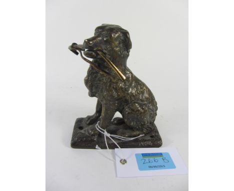 Edwardian bronze model of a dog holding a riding crop 13cm