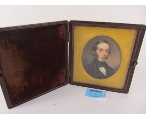 19th century oval portrait miniature on ivory in hinged velvet lined leather case 7cm x 7cm