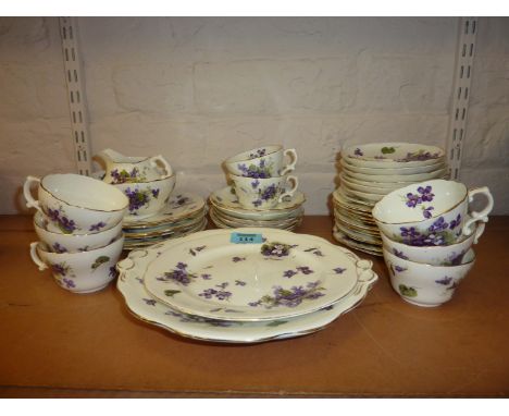 Hammersley & Co. tea service decorated with violets  Condition Report 8 cups
12 saucers
12 side plates
6 18cm diameter plates