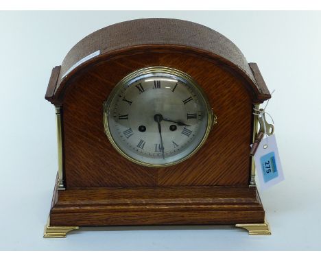 Edwardian oak cased mantel clock with brass mounts and rack striking French movement