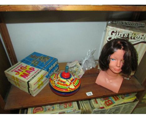 A boxed vintage girls world make-up and styling head, A Chad Valley spinning top and 3 vintage jigsaw puzzles.