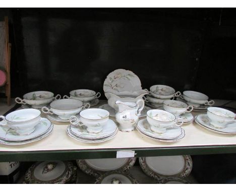 A shelf of German porcelain table ware.