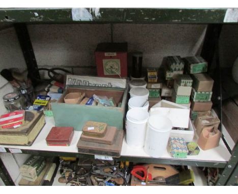 A shelf of nails, screws etc.,