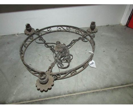 A wrought iron ceiling light,.
