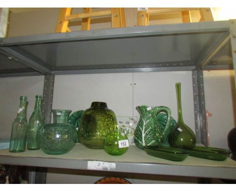 A mixed lot of green glass and pottery items (1 shelf)