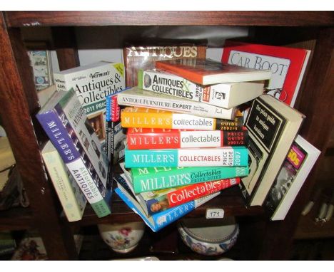 A shelf of antique reference books.