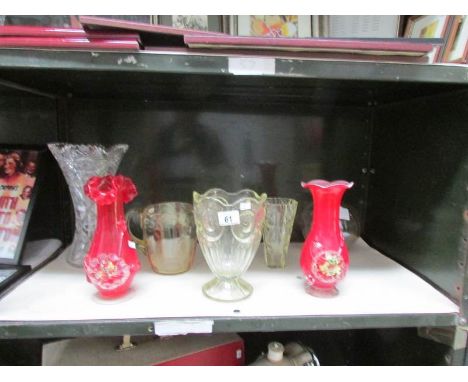 A shelf of glass vases.