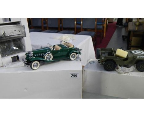 A Danbury Mint WW2 jeep and 1932 Cadillac.