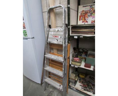A step ladder and a folding chair,