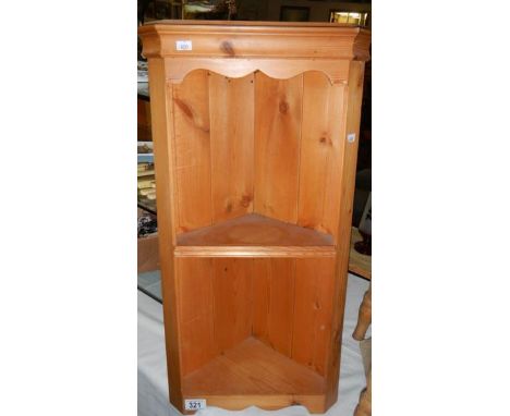 A pine corner shelf.
