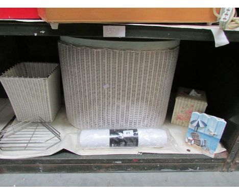 A shelf of bathroom items.
