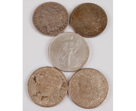 USA, 1883 Morgan dollar, obv; Liberty head above date, rev; spreadeagle with arrows within wreath and legend, together with t