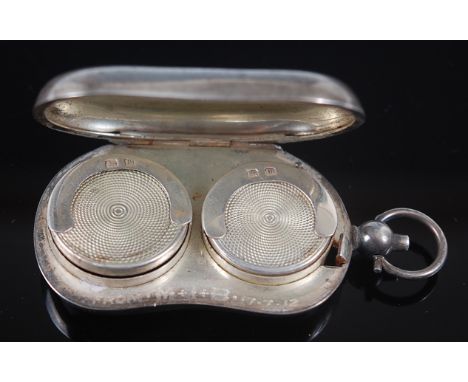 A George V silver double sovereign case of kidney shape with monogrammed cover, William Hair Haseler, Birmingham, 1911. (1)