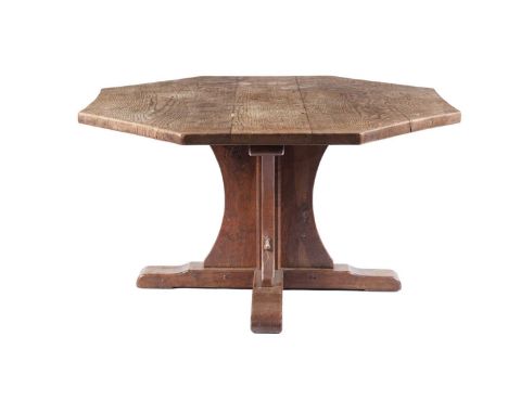 Robert ‘Mouseman’ Thompson of Kilburn: an oak octagonal dining table, circa mid 1930’s, hand adzed octagonal top, raised on c