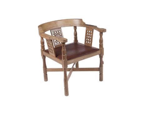 Robert ‘Mouseman’ Thompson of Kilburn: an oaks monks chair, circa late 20th Century, with curved back and shaped arms over th