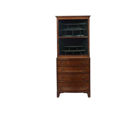 A George III fiddleback mahogany display cabinet on chest, the glazed top lined and shelved above bow fronted base fitted fou
