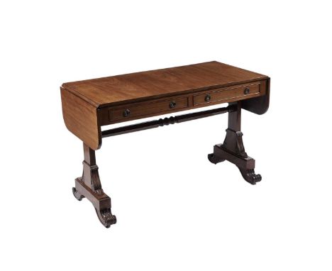 A Regency mahogany sofa table, the rectangular double flap top above a pair of frieze drawers with opposing dummy drawers, fi