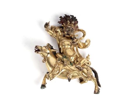 A Sino-Tibetan gilt bronze figure of the Goddess Palden Lhamo, probably 17th/18th Century, depicted holding a skull cup, and 