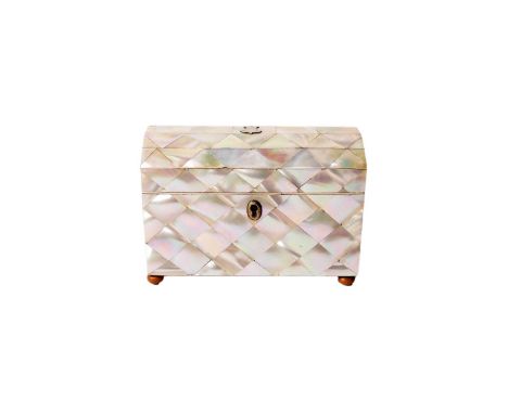 A Victorian mother-of-pearl tea caddy, the hinged domed top with unengraved shield shaped white metal cartouche, opening to r