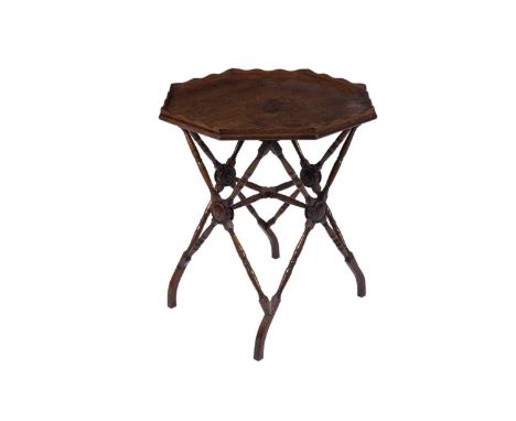 A late 19th Century oak Aesthetic period side table by Bertram &amp; Son, the octagonal top with a wavy gallery, raised on a 