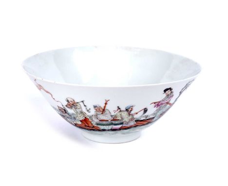 A Chinese famille rose bowl, 20th Century, decorated with immortals being transported on a raft to a rocky island outcrop wit