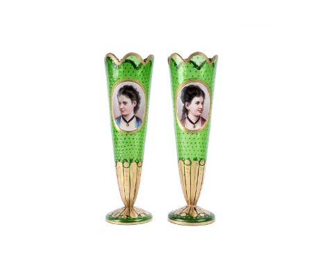 A pair of 19th Century Bohemian overlay green glass vases, of trumpet shape with oval painted portrait medallion, on a gilt s