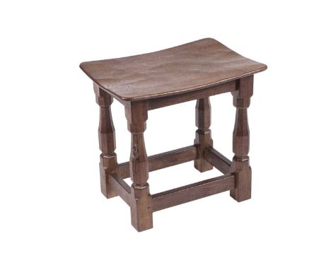 Robert ‘Mouseman’ Thompson of Kilburn: an oak dish-top stool, with nailed and adzed seat on four octagonal legs, joined by fo