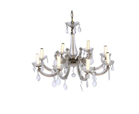 An early 20th Century eight-branch glass chandelier, the eight curved arms with short decorative arms above, the lamp holders