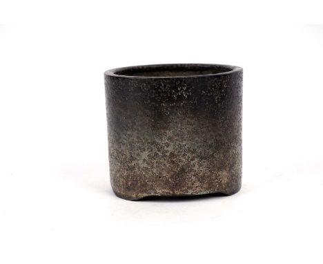 A patinated Chinese bronze cylindrical brush washer, with textured finish, cast seal mark, 8cms high.