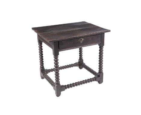 A 19th Century oak lowboy, the rectangular top above single frieze drawer raised on turned bobbin legs and stretchers, 71 x 5