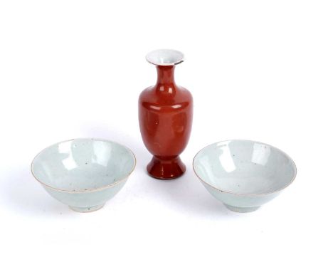A pair of provincial Chinese celadon glazed rice bowls, Qing, one with stylised seal mark in blue, the other with single char