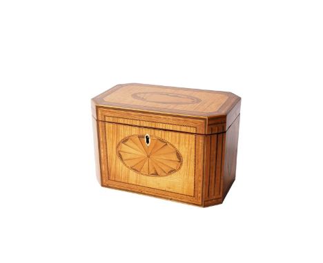 A Georgian satinwood inlaid and banded tea caddy, of elongated octagonal form, the front, reverse and side panels with inlaid