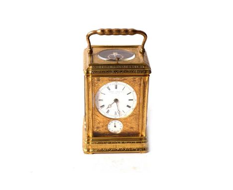 A 19th Century French gilt brass repeating carriage alarm clock, the white enamel Roman dial signed 'Howell, James &amp; Co, 