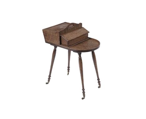 A Regency oak butlers cutlery stand, the hinged top with brass lion mask handle beside sloped compartment and plate shelf, ra