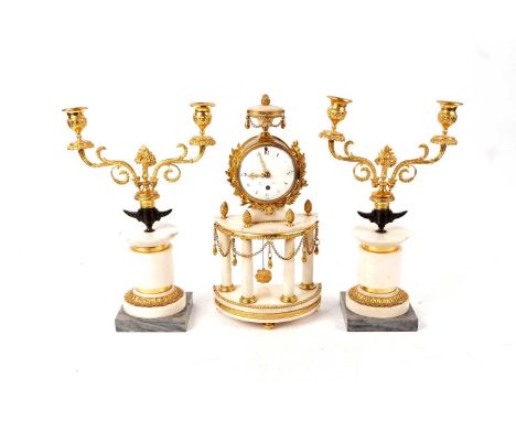 A 19th Century French Louis XVI style white marble and gilt three-piece clock garniture, the clock with circular white enamel