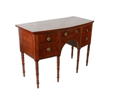 A Georgian mahogany bowfront sideboard, c.1810, three oak and pine lined drawers with old replacement brass ring handles, the