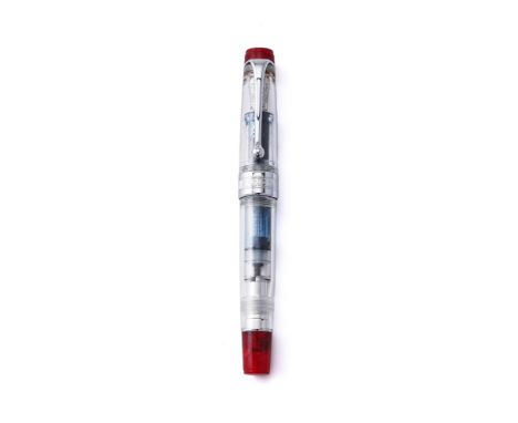 
	
		AURORA, DEMONSTRATOR 
		A LIMITED EDITION RESIN FOUNTAIN PEN 
		Cap and Barrel: Clear resin cap and barrel with red marb