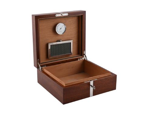 
	
		A WOODEN AND SILVER MOUNTED HUMIDOR
		ASPREY LTD., LONDON 2005
		With a silver band and key lock, opening to a cedar lin
