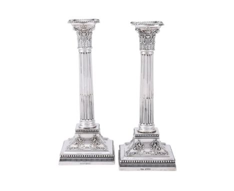 
	
		A PAIR OF VICTORIAN SILVER CORINTHIAN CANDLESTICKS
		JAMES DIXON &amp; SON, SHEFFIELD 1896
		With beaded sconces, foliat