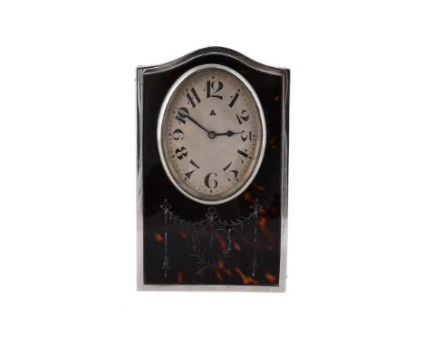 
	
		Y&nbspA SILVER AND TORTOISESHELL MOUNTED DESK CLOCK
		CHARLES S. GREEN &amp; CO. LTD., BIRMINGHAM 1922
		With an 8 day m