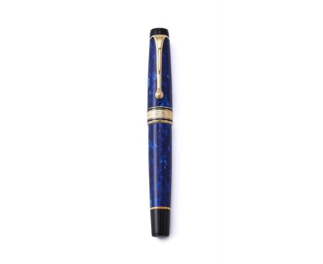 
	
		AURORA, OPTIMA 
		A BLUE RESIN FOUNTAIN PEN 
		Cap and Barrel: Marbled blue resin cap and barrel with yellow coloured cl