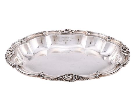 
	
		A GEORGE IV SILVER SHAPED OVAL ENTREE DISH
		BENJAMIN SMITH II, LONDON 1825
		With a foliate scroll border and engraved 