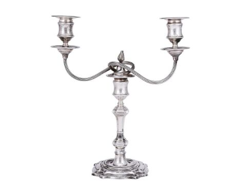 
	
		A SILVER TWIN LIGHT CANDELABRA
		JAMES DIXON &amp; SONS LTD., SHEFFIELD 1965
		With circular sconces, waisted capitals, 