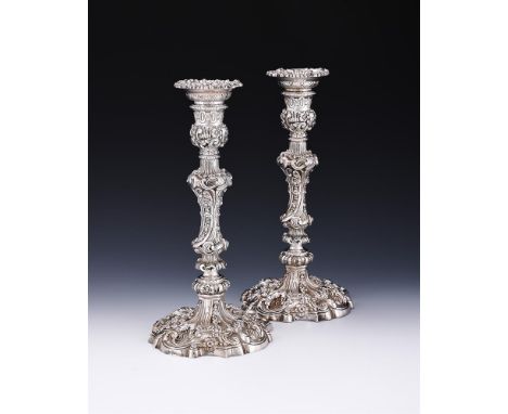 
	
		A PAIR OF LATE VICTORIAN SILVER CANDLESTICKS
		WALKER &amp; HALL, SHEFFIELD 1897 
		With chased floral shaped circular s