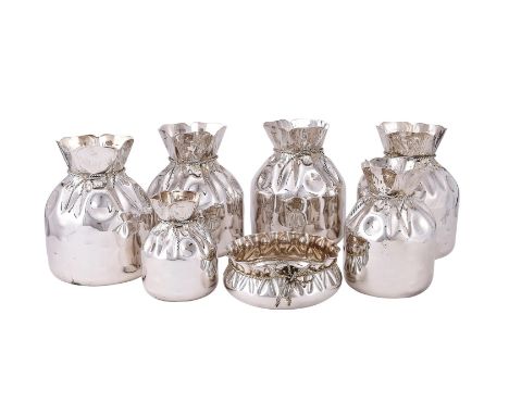 
	
		A SET OF SIX ELECTRO-PLATED VASES
		ALMAZAN, CIRA 1960
		In the form of open drawstring bags
		17cm (6 3/4in), 22cm (8 3