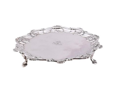 A GEORGE III SILVER SHAPED CIRCULAR WAITER MAKER'S MARK I.C, LONDON 1767 With a shell and C-scroll border, engraved with a cr