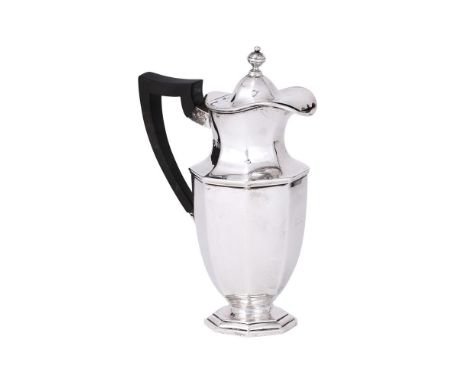 
	
		AN EDWARDIAN SILVER OCTAGONAL HOT WATER JUG
		LAMBERT &amp; CO., LONDON 1907
		With an orb finial to the domed cover, a 